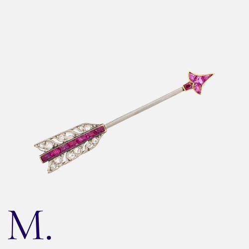 54 - CARTIER , An Art Deco Ruby And Diamond Arrow about Pin in yellow gold and platinum, designed as an a... 