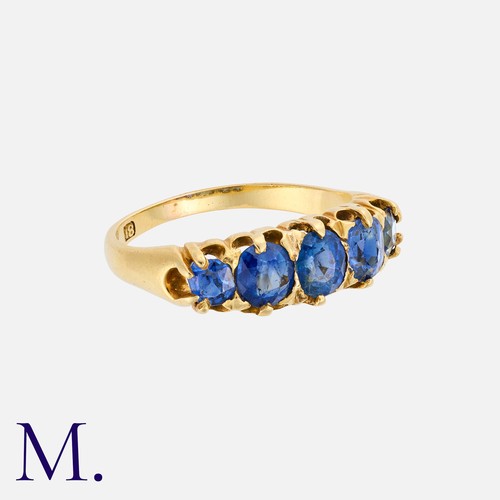 1 - A Sapphire Five Stone Ring in 18k yellow gold, set with a row of five graduated oval cut sapphires. ... 