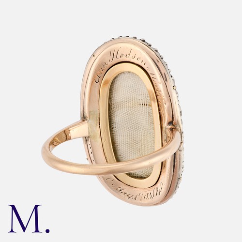 27 - An Antique Enamel And Diamond Mourning Ring in yellow gold and silver, the oval shaped face decorate... 