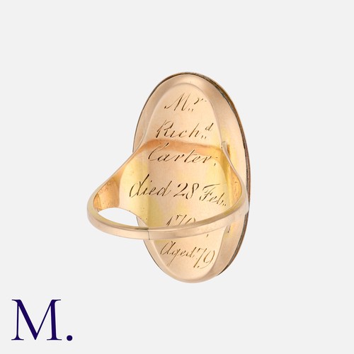 8 - An Antique Enamel Mourning Ring in yellow gold, the oval shaped face with a blue and white enamelled... 