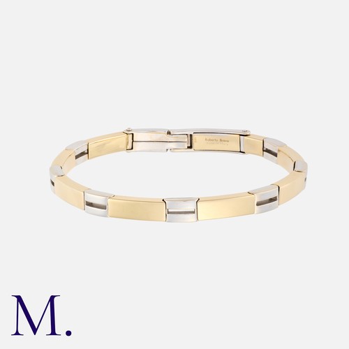 51 - ROBERTO BRAVO. A 2-Colour Gold Bangle made up of alternating 14K white and yellow gold hinged links ... 