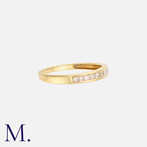 1 - NO RESERVE - A Diamond Band in 18ct yellow gold with nine channel-set princess-cut diamonds weighing... 