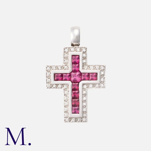 59 - A Rubellite Tourmaline And Cross Pendant in 18k white gold, of crucifix form set with princess cut r... 