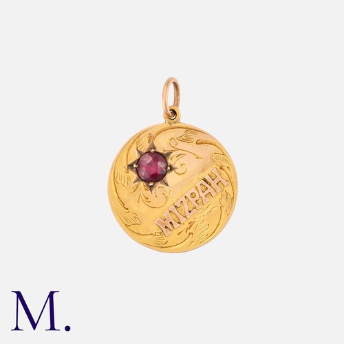 5 - A Mizpah Pendant in 9ct yellow gold, set with a garnet.

Size: 20mm
Weight: 2.0g