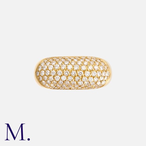 20 - A Diamond Ring in 18k yellow gold, pavé set with nine rows of round cut diamonds totalling approxima... 