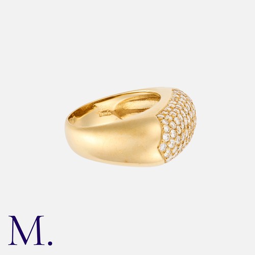 20 - A Diamond Ring in 18k yellow gold, pavé set with nine rows of round cut diamonds totalling approxima... 