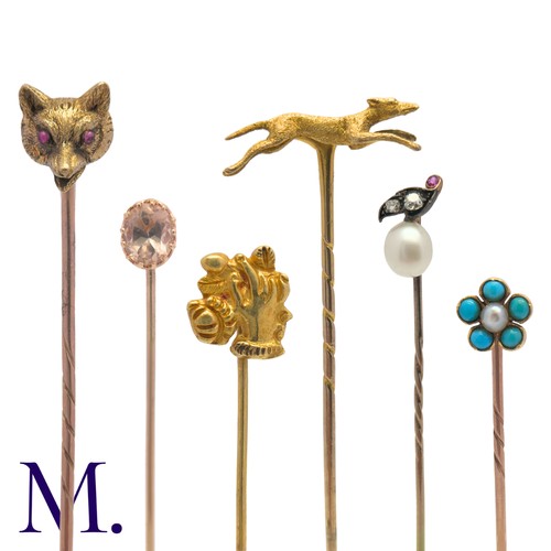 69 - A Collection of Antique Stick Pins in yellow gold including one set with golden topaz (7.4cm), one w... 