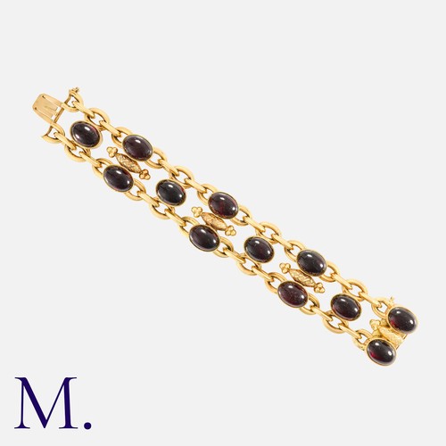 157 - An Antique French Garnet Bracelet in 18k yellow gold, comprising a series of interlocking links punc... 