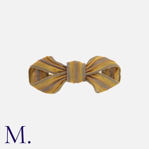 4 - A Woven Bow Brooch created from fine 15K yellow and rose gold and platinum, with gold brooch fitting... 