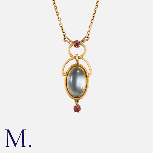 47 - An Edwardian Moonstone and Ruby Pendant Necklace in yellow gold, pendant set to the centre with an o... 