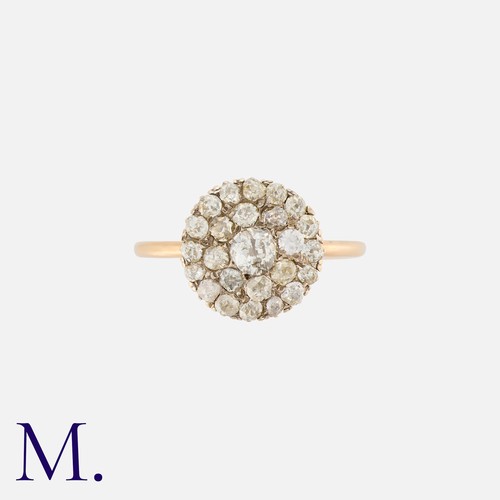 62 - An Old Cut Diamond Cluster Ring in 18K gold, set with a cluster of old cut diamonds weighing approx.... 