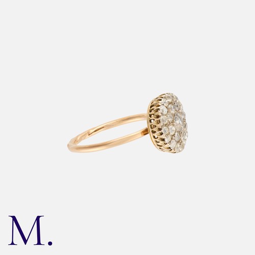 62 - An Old Cut Diamond Cluster Ring in 18K gold, set with a cluster of old cut diamonds weighing approx.... 