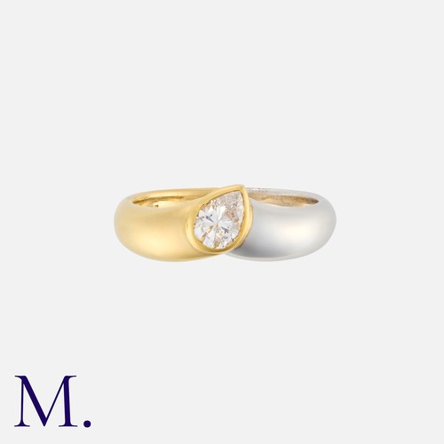 82 - A Diamond Ring in 18K yellow and white gold, set to the centre with a pear cut diamond weighing appr... 