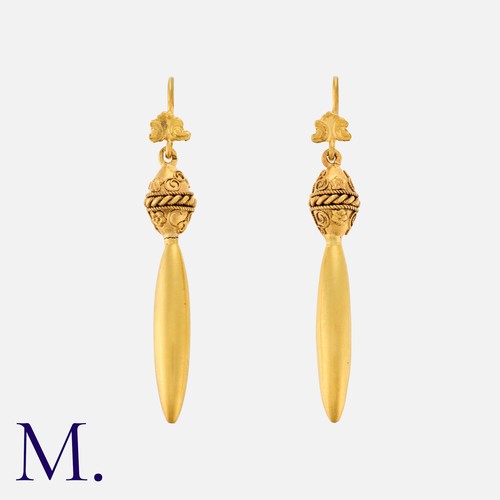 33 - An Antique Pair Of Drop Earrings in 18k yellow gold, each comprising a scrolling top suspending a fl... 