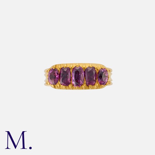 13 - An Antique Ruby Five Stone Ring in yellow gold, set with a row of elongated oval cut rubies. Unmarke... 