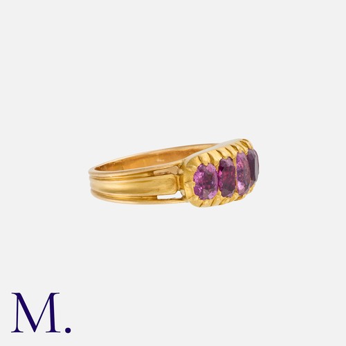 13 - An Antique Ruby Five Stone Ring in yellow gold, set with a row of elongated oval cut rubies. Unmarke... 