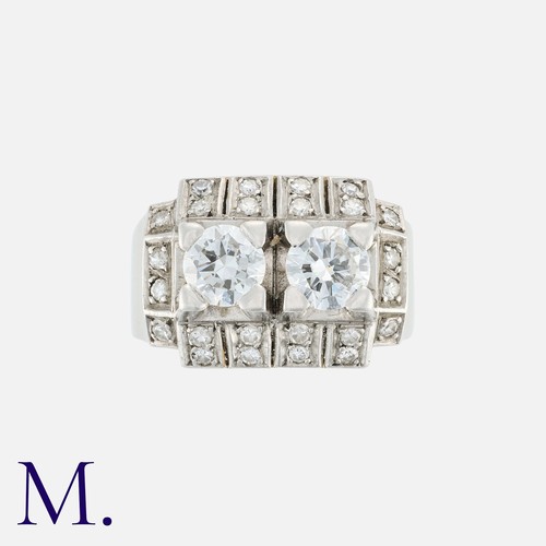 32 - A French Diamond Ring in 18k white gold, set with two principal transitional cut diamonds each weigh... 