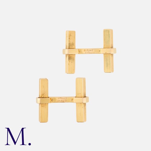 52 - MELLERIO. A Pair of Cufflinks in 18ct yellow gold with ribbed geometric batons.  Signed Mellerio and... 