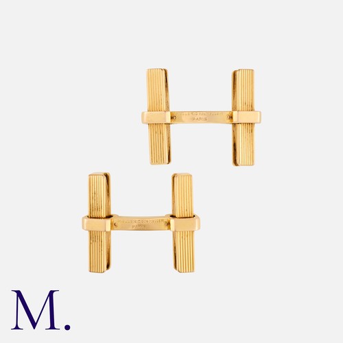 52 - MELLERIO. A Pair of Cufflinks in 18ct yellow gold with ribbed geometric batons.  Signed Mellerio and... 