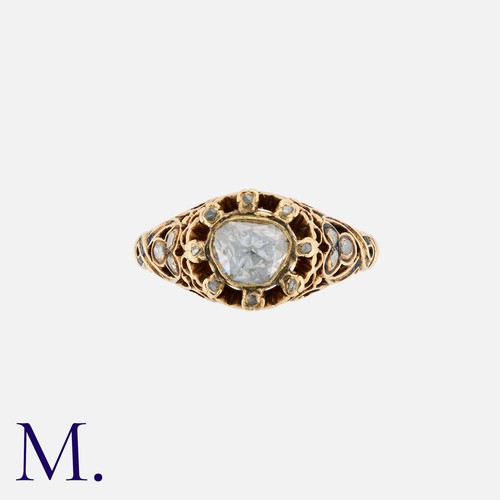 55 - An Antique Rose Cut Diamond Ring in yellow gold, the ornate  body set with a principal rose cut of a... 