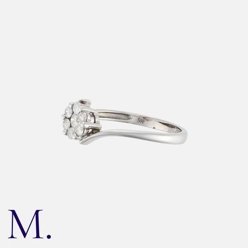 20 - NO RESERVE. A Diamond Cluster ring in 9k white gold, the central cluster of seven round cut diamonds... 