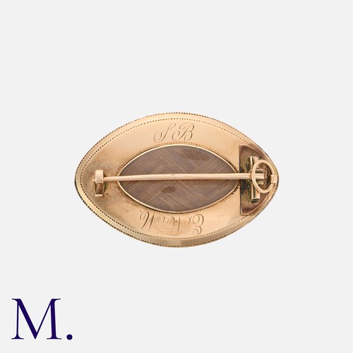 33 - A Georgian Miniature Locket Brooch in yellow gold with hairwork to locket reverse.

Size: 4.0cm
Weig... 