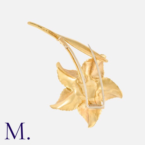 48 - HERMES. A Flower Brooch in 18K yellow gold, with five-petal textured flower.  Signed Hermes Paris an... 
