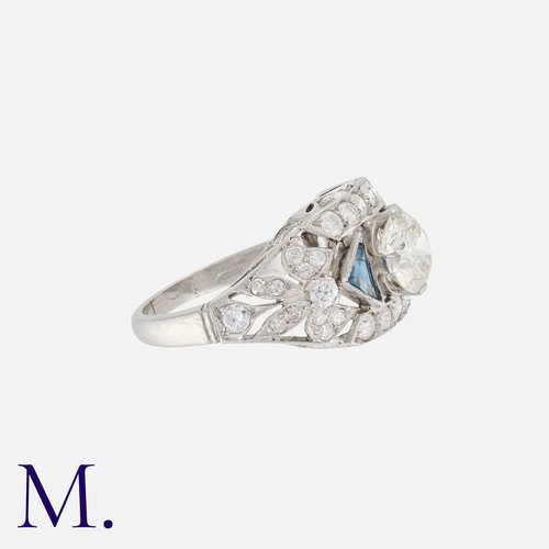 16 - An Art Deco Sapphire and Diamond Ring in platinum, set centrally with a diamond weighing 1.35ct., wi... 
