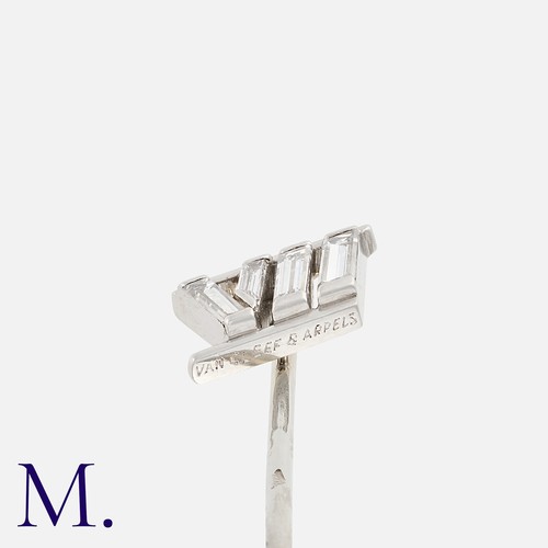 59 - VAN CLEEF & ARPELS. A Diamond Pin in 18k white gold and platinum in the design of a Roman numeral VI... 