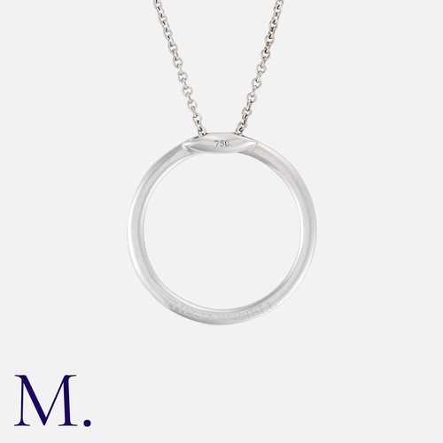 47 - THEO FENNEL, A Diamond Pendant Necklace in 18k white gold, designed as an open circle, set with whit... 