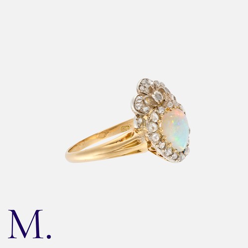 2 - An Opal And Diamond Sweetheart Ring in 18k yellow gold and silver, comprising a heart shaped cabocho... 