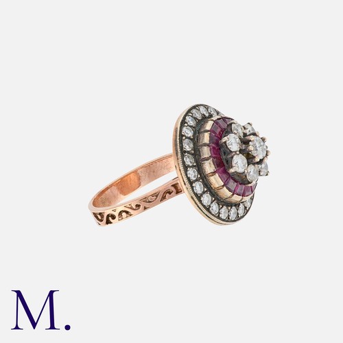 5 - A Ruby and Diamond Ring in rose gold, set with calibre rubies and round cut diamonds weighing approx... 