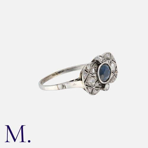 29 - NO RESERVE. A Sapphire and Diamond Ring set in the centre of a plaque with an oval cut sapphire meas... 