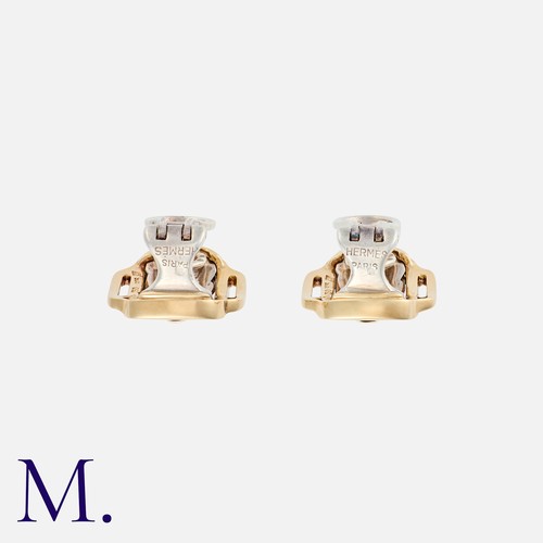 43 - HERMES. A Pair of Earclips in 18K yellow gold and silver, in a belt buckle design.  Signed Hermes Pa... 
