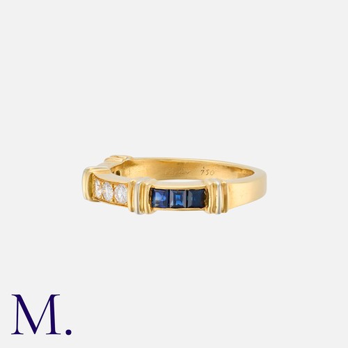 41 - CARTIER. A Diamond and Sapphire Ring in 18K set with three round brilliant diamonds and six square c... 