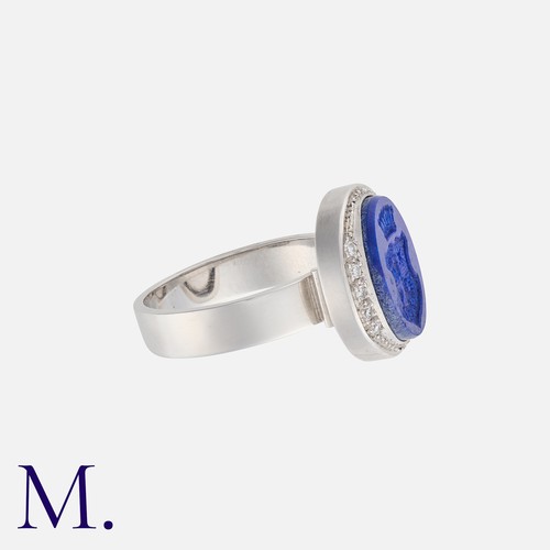 173 - A Lapis Lazuli and Diamond Signet Ring set in 18K white gold, with carved intaglio in lapis lazuli w... 