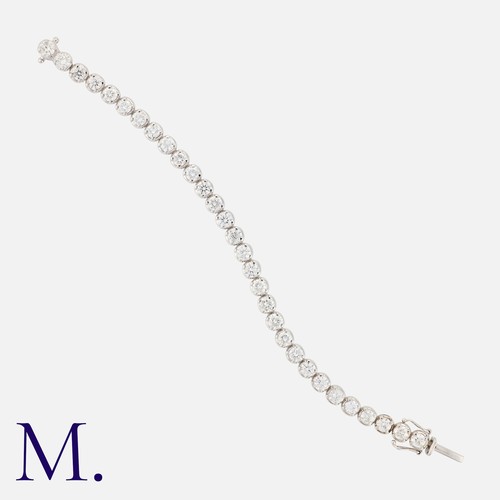 135 - A Diamond Line Bracelet in 18k white gold, comprising a row of thirty round brilliant cut diamonds, ... 