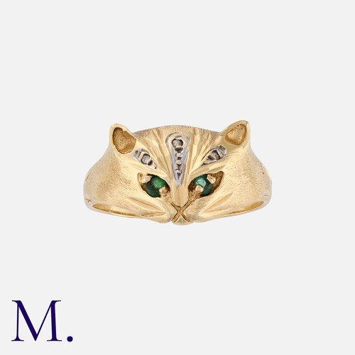 193 - An Emerald And Diamond Cat Ring in 9k yellow gold, designed as the face of a cat, set with emerald e... 