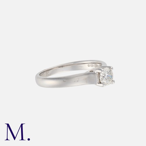 145 - A Diamond Solitaire Ring in 18k white gold, set with a principal round cut diamond of approximately ... 