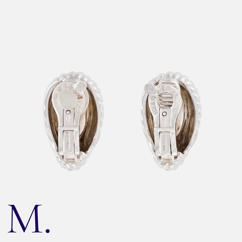 136 - BOUCHERON. A Pair of Earrings in 18K white gold, of fluted design.  Signed Boucheron and French mark... 