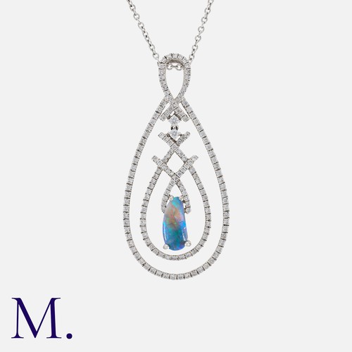 198 - An Opal And Diamond Pendant Necklace in 18k white gold, comprising a diamond set drop, set centrally... 