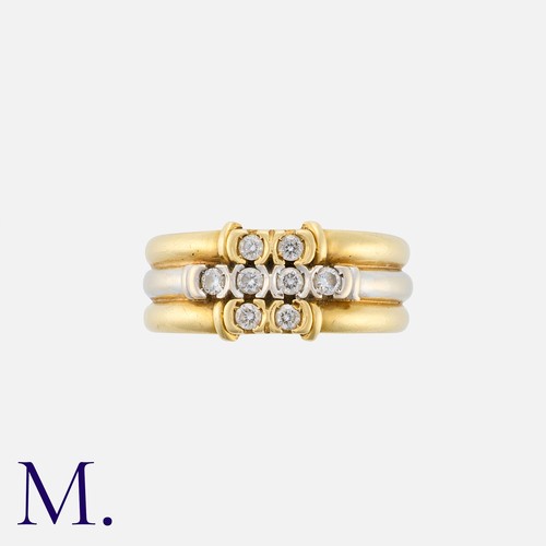 171 - A Diamond Ring in 18K yellow and white gold, set with eight round cut diamonds to the front weighing... 