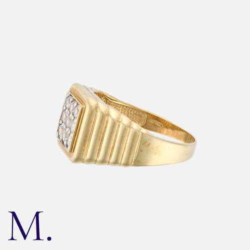 48 - A Gold Ring with stepped shoulders in 9K yellow gold set with nine cubic zirconia stones.  Hallmarke... 