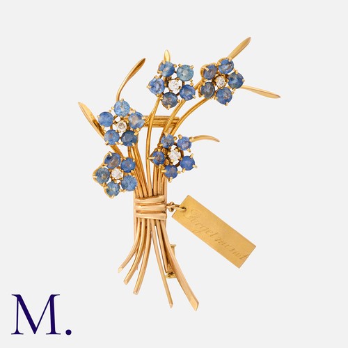 157 - VAN CLEEF & ARPELS. A Forget-Me-Not Bouquet Brooch in 18K yellow gold, with rotating flower heads se... 