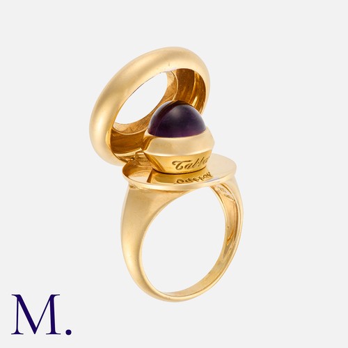 34 - TABBAH. An Amethyst Ring in 18K yellow gold, with a cabochon amethyst to the centre of a round curve... 