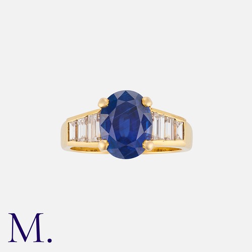 158 - A Burma Sapphire and Diamond Ring in 18K yellow gold, set with an oval cut sapphire of approx. 3.3ct... 