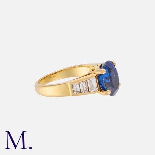 158 - A Burma Sapphire and Diamond Ring in 18K yellow gold, set with an oval cut sapphire of approx. 3.3ct... 