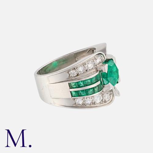 146 - An Emerald and Diamond Retro Ring in white gold, set with a hexagonal-cut emerald to the centre with... 