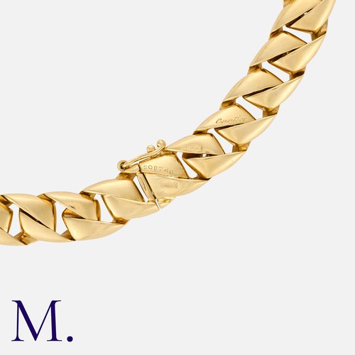 130 - CARTIER. A Sapphire and Diamond Collar in 18K yellow gold, set with a cabochon sapphire to the centr... 