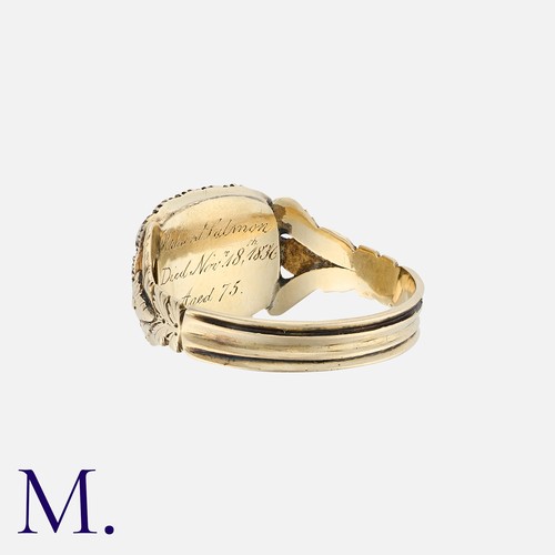 16 - A Georgian Mourning Ring in yellow gold, with locket to the front and pearls in surround.  Inscribed... 